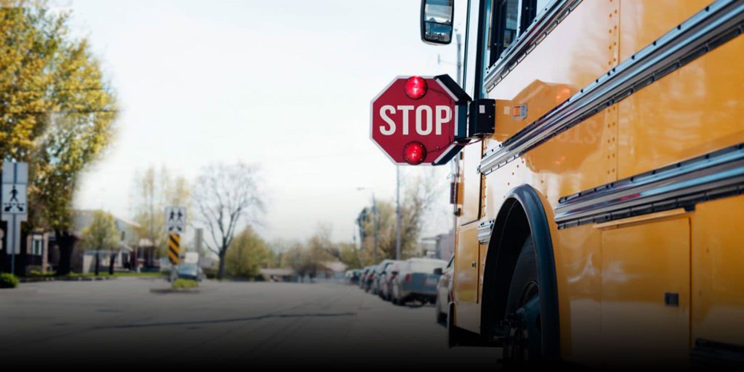 School bus stopped in a neighborhood.
